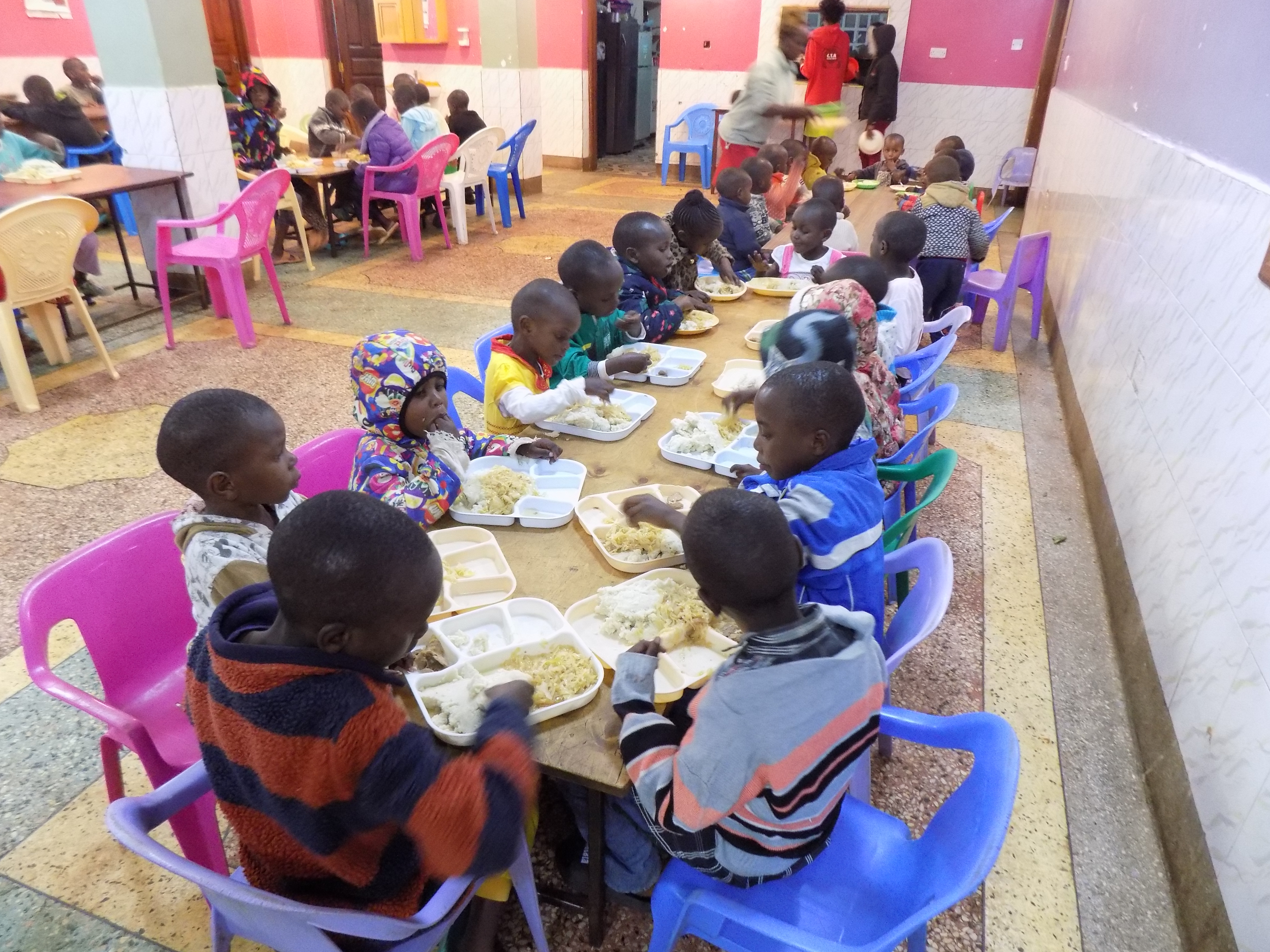 Children at mealtime at Bethesda Child Care Centre