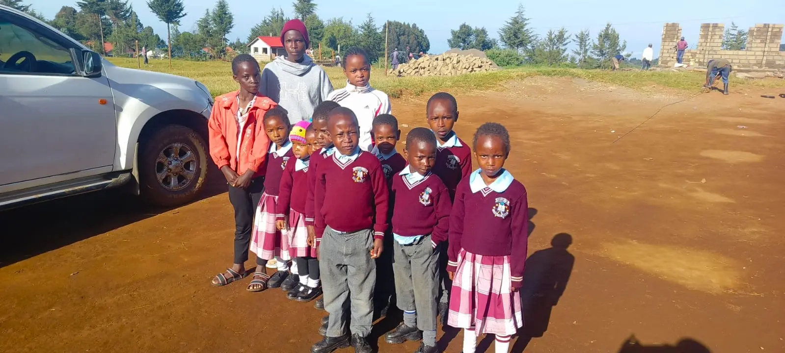 Children with a caregiver outdoors at Bethesda Child Care Centre