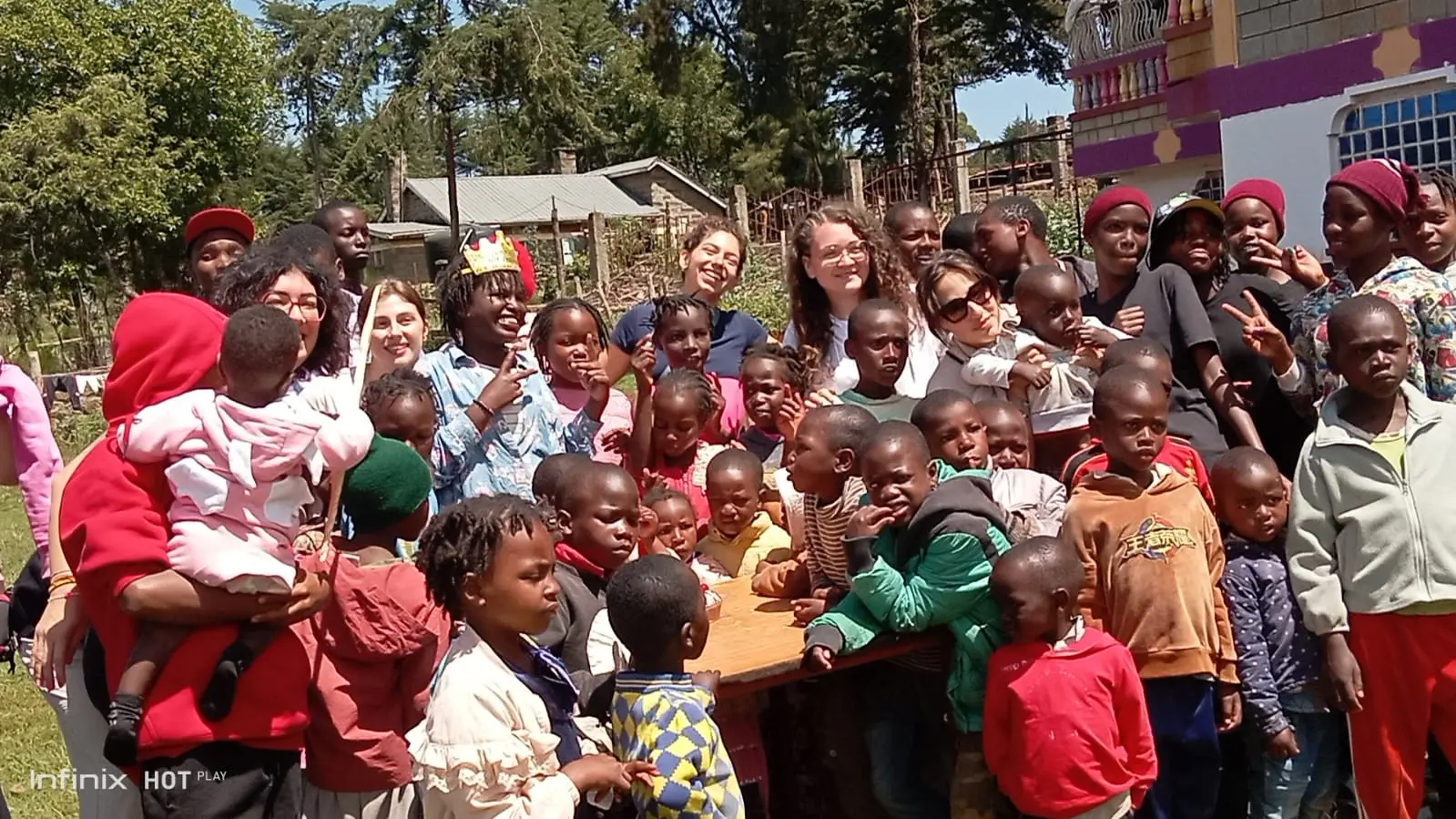 Children, caregivers and visitors gathered outdoors at Bethesda Child Care Centre in Mirangine, Nyandarua County, Kenya