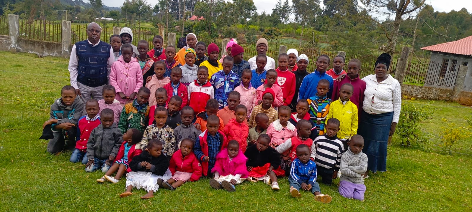 Children and caregivers gathered together at Bethesda Child Care Centre, Mirangine, Kenya