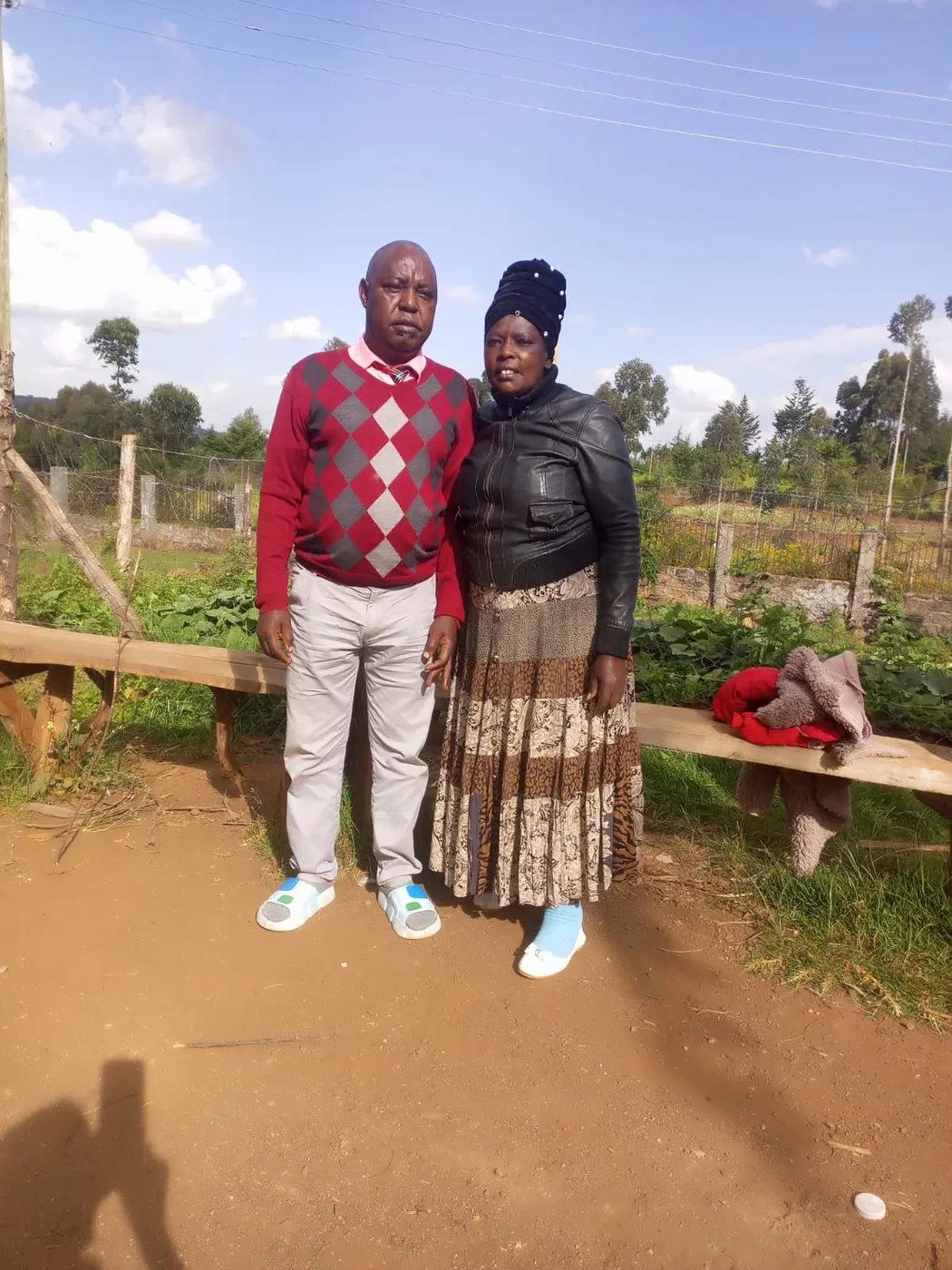 Pastor John Kamau and Elizabeth Gachiri standing outdoors at Bethesda Child Care Centre