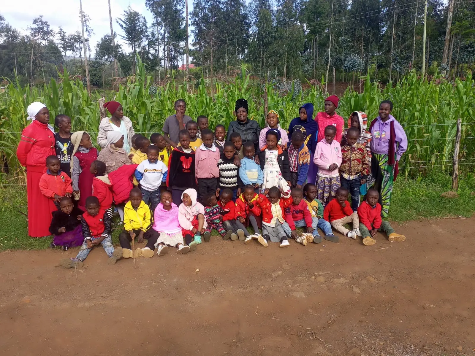 Children and caregivers gathered together outdoors at Bethesda Child Care Centre